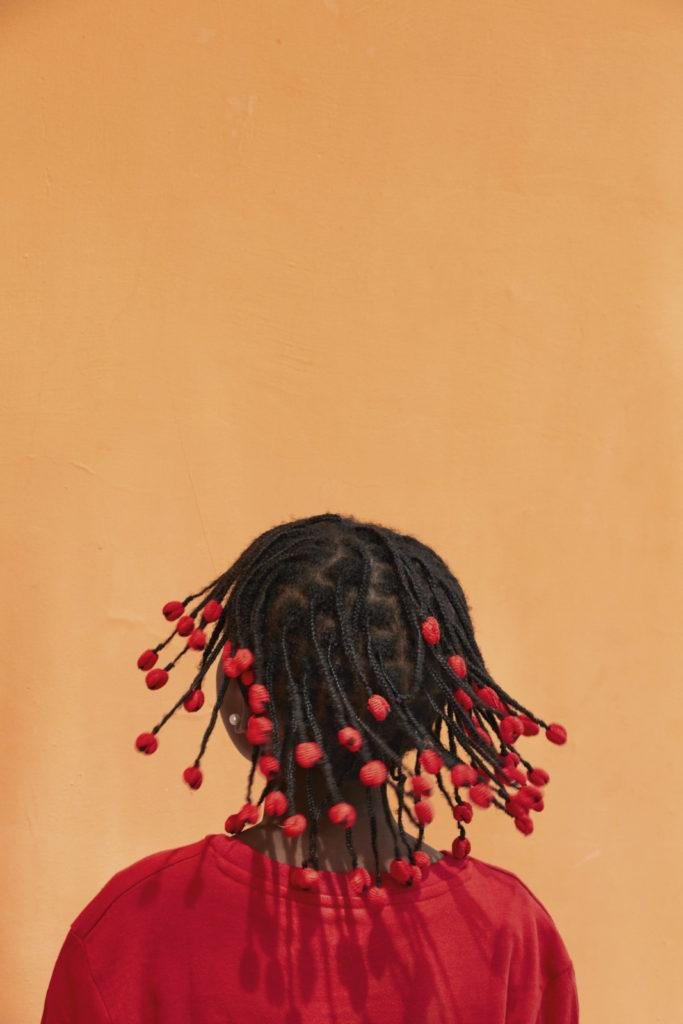 Laura Bonnefous  | Red beads against orange